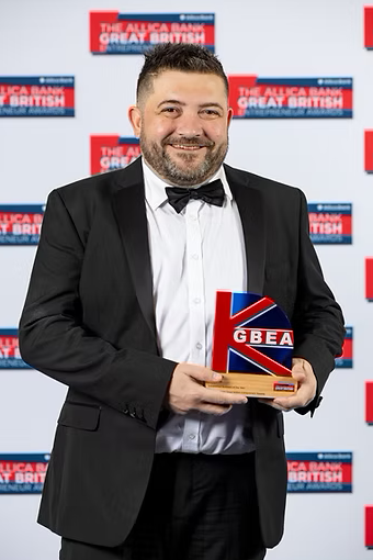 Steve Coole holding the Established Business of the Year award